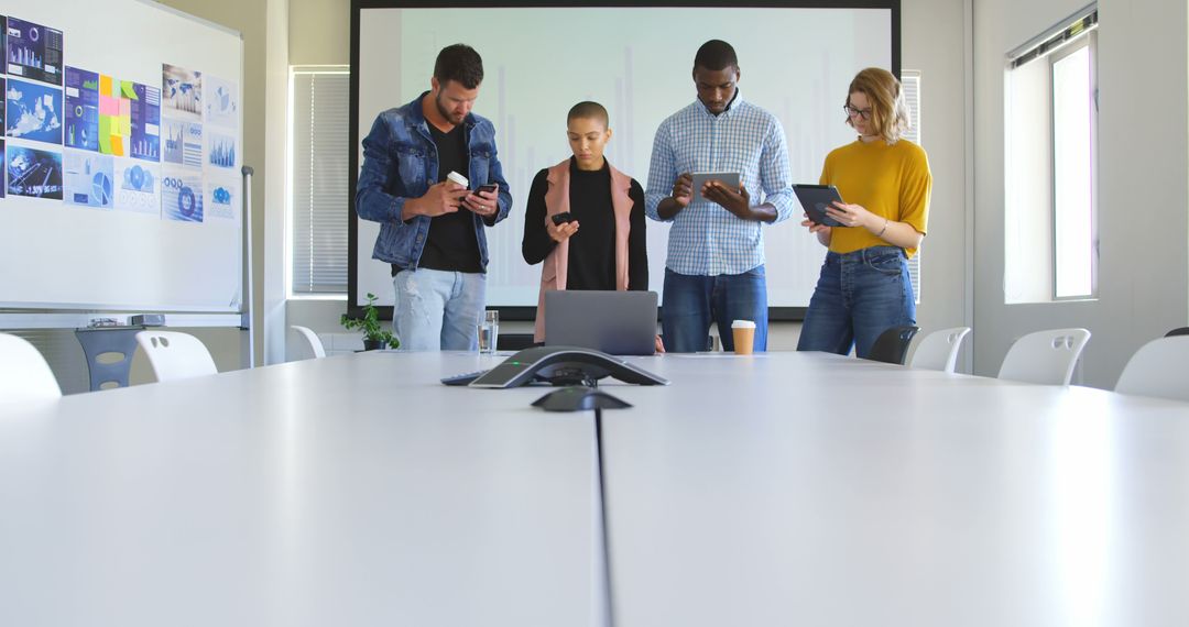 Diverse Team Collaborating in Modern Office with Gadgets