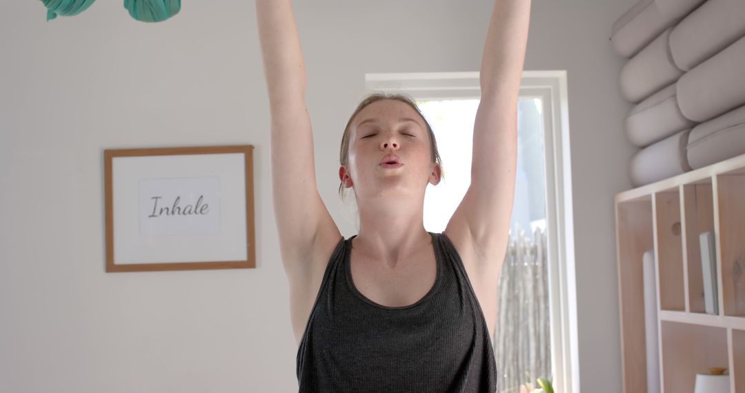 Woman Practicing Yoga at Home with Calm Expression - Free Images, Stock Photos and Pictures on Pikwizard.com