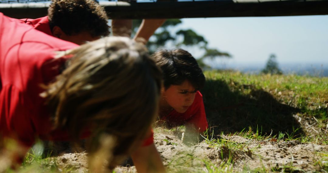 Children Crawling Through Obstacle Course on Sunny Day - Free Images, Stock Photos and Pictures on Pikwizard.com