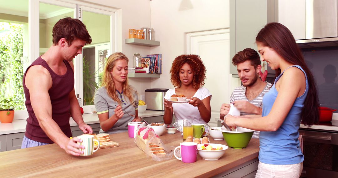 Group of Young Friends Making Breakfast in Modern Kitchen - Free Images, Stock Photos and Pictures on Pikwizard.com