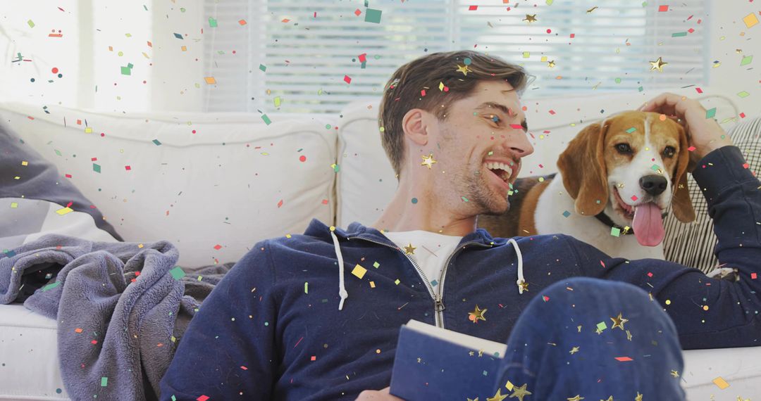 Man with Beagle Relaxing on Couch Amidst Colorful Confetti
