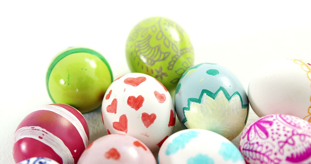 A vibrant display of patterned Easter eggs against a white backdrop offers room for text. - Free Images, Stock Photos and Pictures on Pikwizard.com