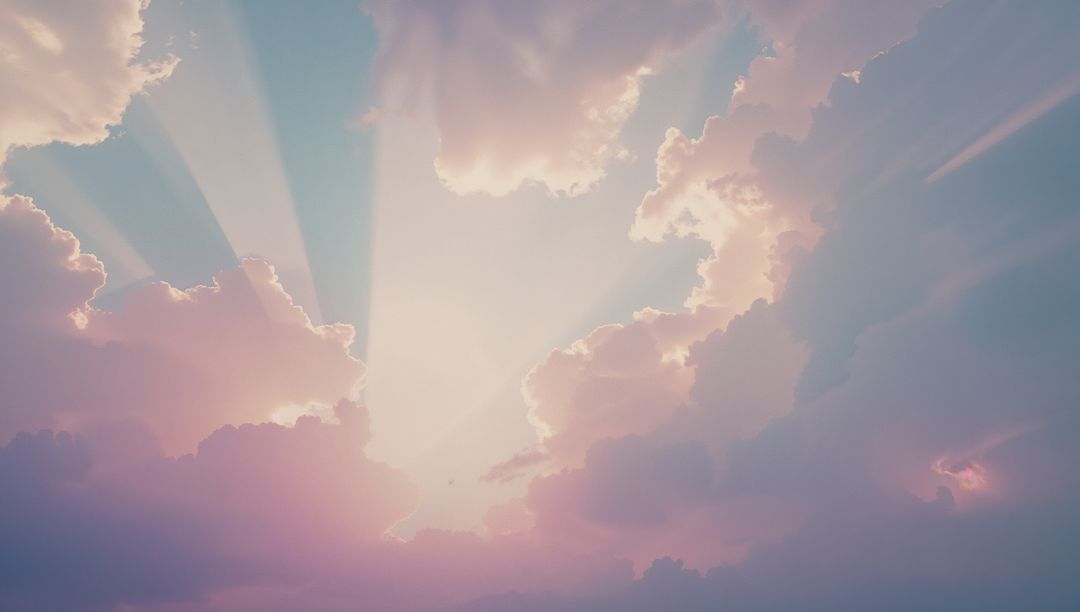 Serene Sunbeams Through Pastel Cumulus Clouds at High Altitude