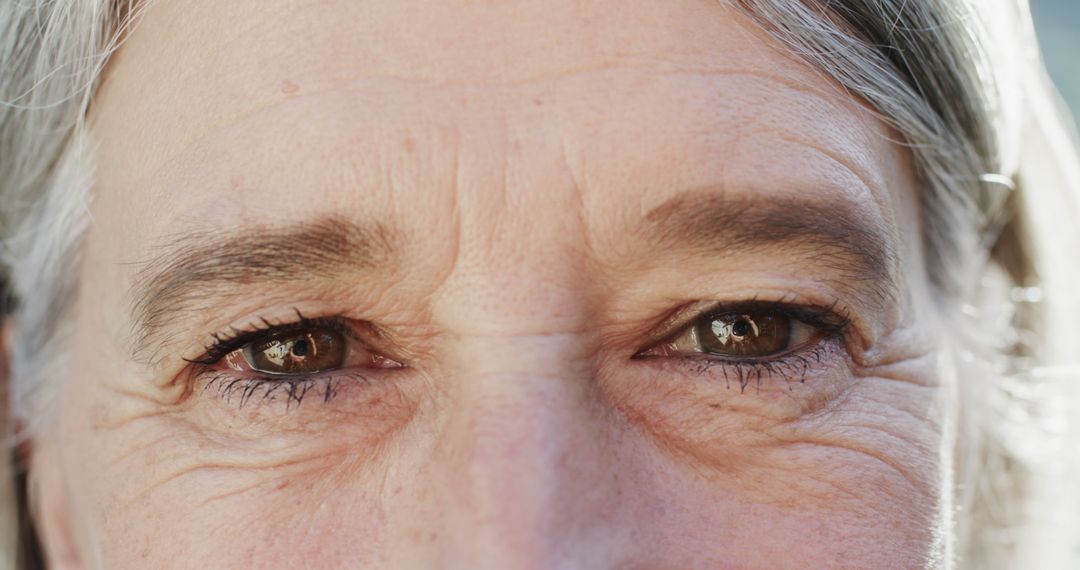 Close-Up of Elderly Woman’s Eyes with Wrinkles - Free Images, Stock Photos and Pictures on Pikwizard.com