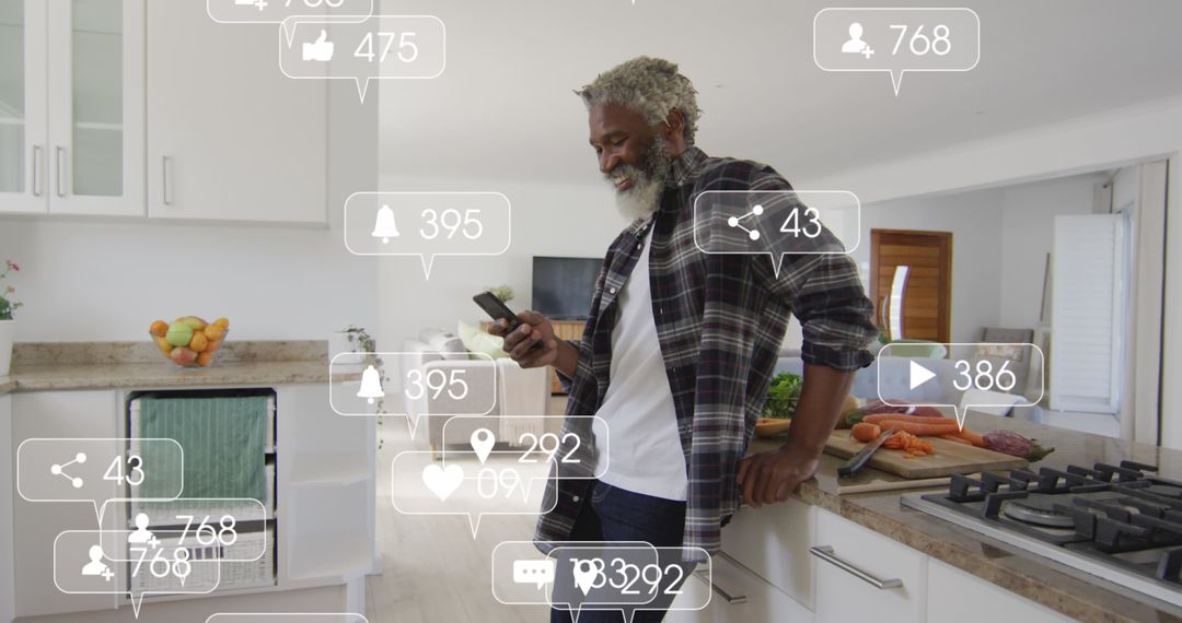 Engaged Senior Man Checking Smartphone in Modern Kitchen