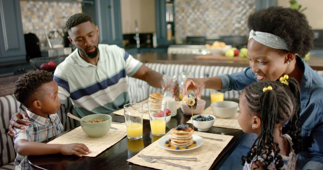 African American Family Enjoying Breakfast Together at Home - Free Images, Stock Photos and Pictures on Pikwizard.com