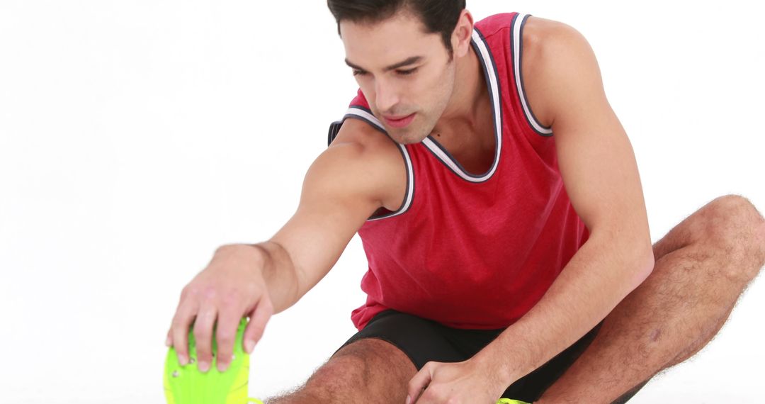 Athletic Man Stretching Before Workout in Sportswear - Free Images, Stock Photos and Pictures on Pikwizard.com