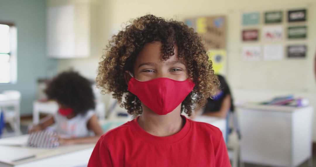 Happy Student Wearing Red Mask in Classroom - Free Images, Stock Photos and Pictures on Pikwizard.com