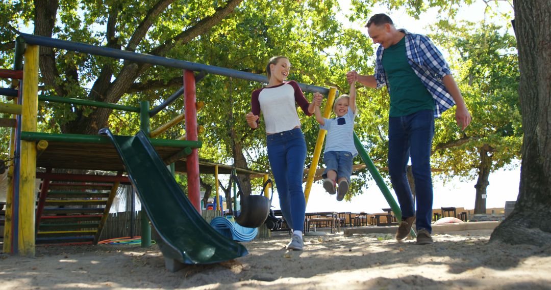 Happy Family Having Fun at Playground - Free Images, Stock Photos and Pictures on Pikwizard.com