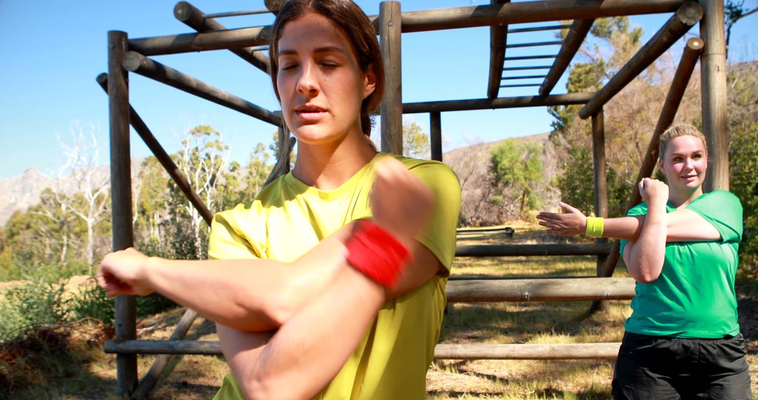 Women stretching at outdoor fitness park - Free Images, Stock Photos and Pictures on Pikwizard.com