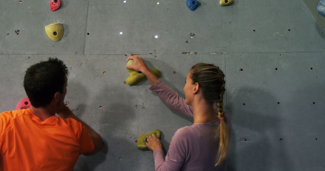 Two Climbers Practicing on Indoor Climbing Wall - Free Images, Stock Photos and Pictures on Pikwizard.com