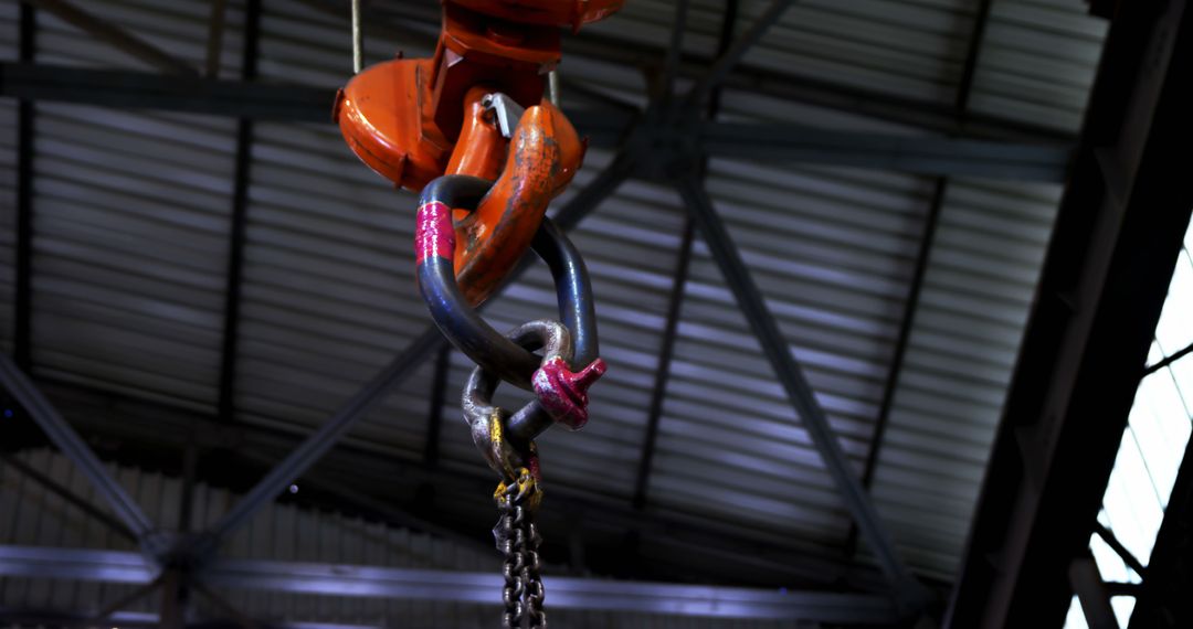 Heavy Industrial Hook Hanging in Manufacturing Facility - Free Images, Stock Photos and Pictures on Pikwizard.com