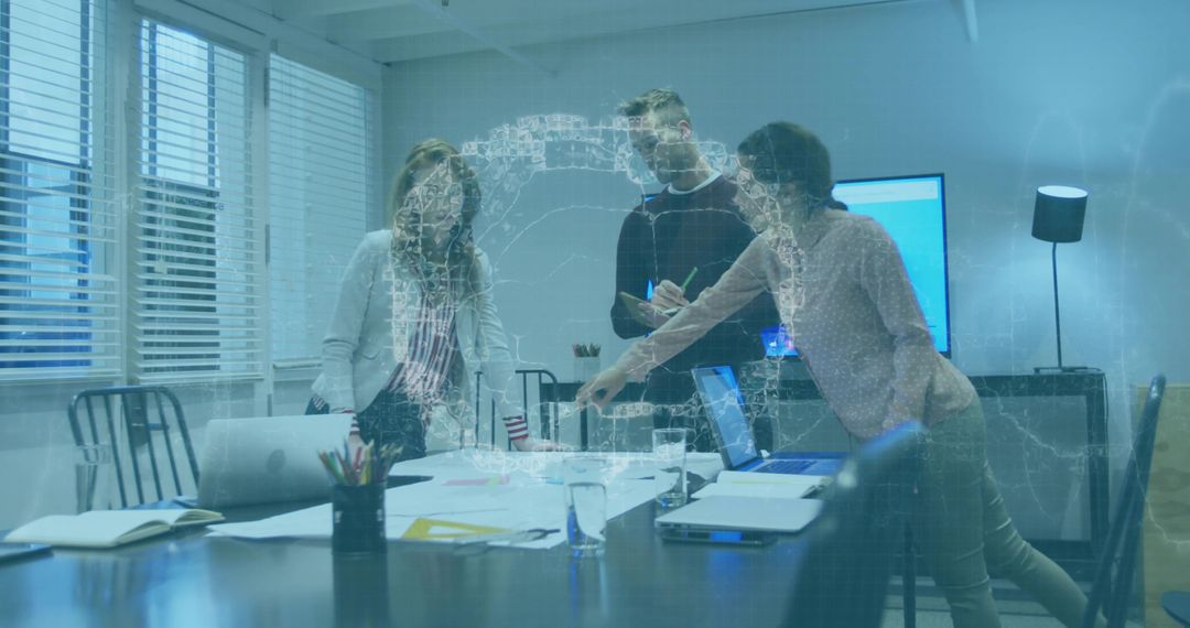 Business team collaborating around conference table with holographic data visualization
