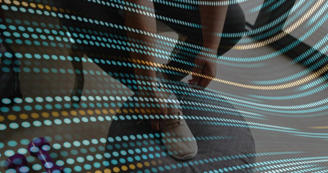 Woman Tying Running Shoe on Foam Mat with Purple Dumbbell and Digital Dot Overlay