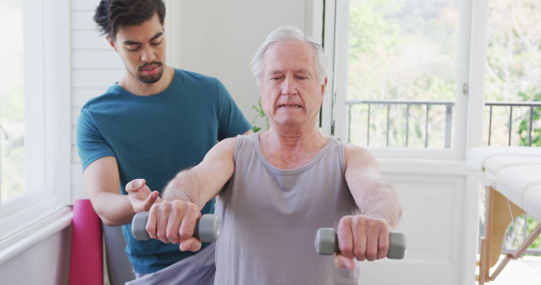 Senior Man Exercising with Personal Trainer in Bright Room - Free Images, Stock Photos and Pictures on Pikwizard.com