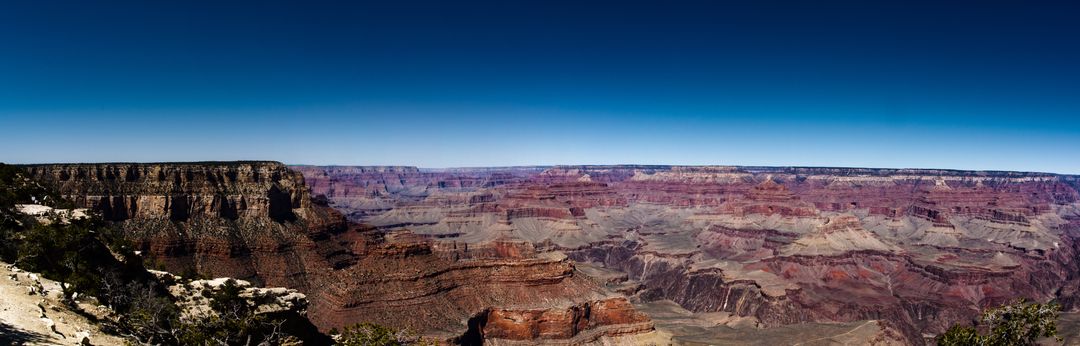 Panoramic View of Grand Canyon under Clear Blue Sky - Free Images, Stock Photos and Pictures on Pikwizard.com