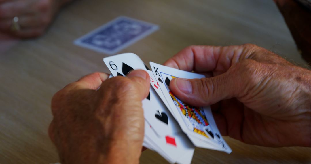 Close-up of Person Holding Playing Cards During Game - Free Images, Stock Photos and Pictures on Pikwizard.com