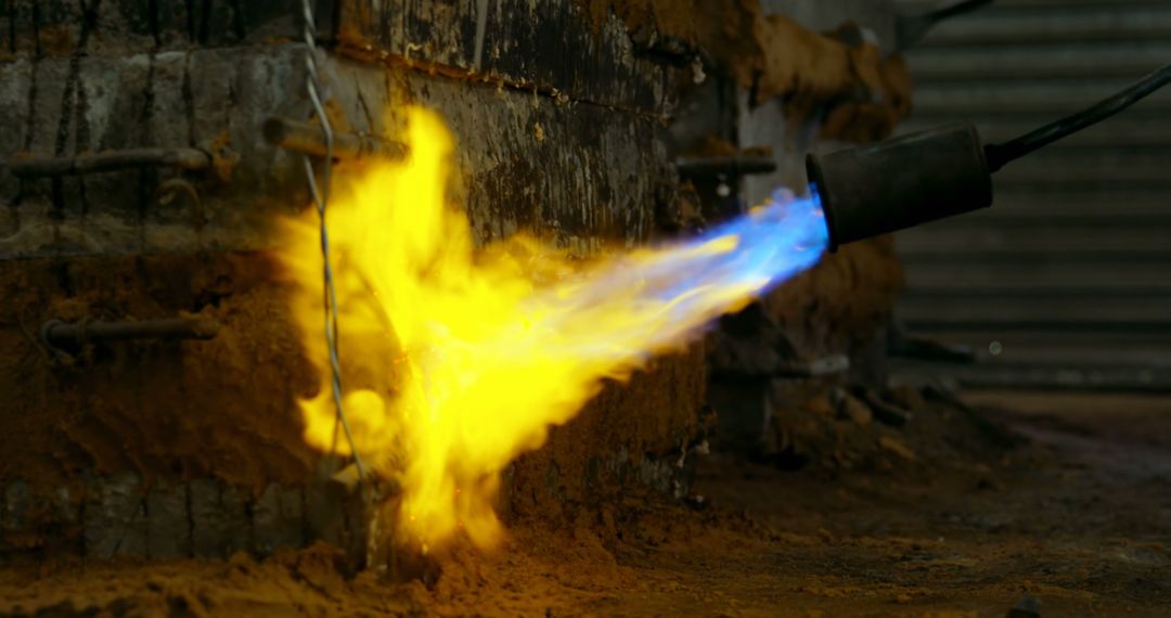 Industrial Blowtorch with Blue and Yellow Flame in Action - Free Images, Stock Photos and Pictures on Pikwizard.com