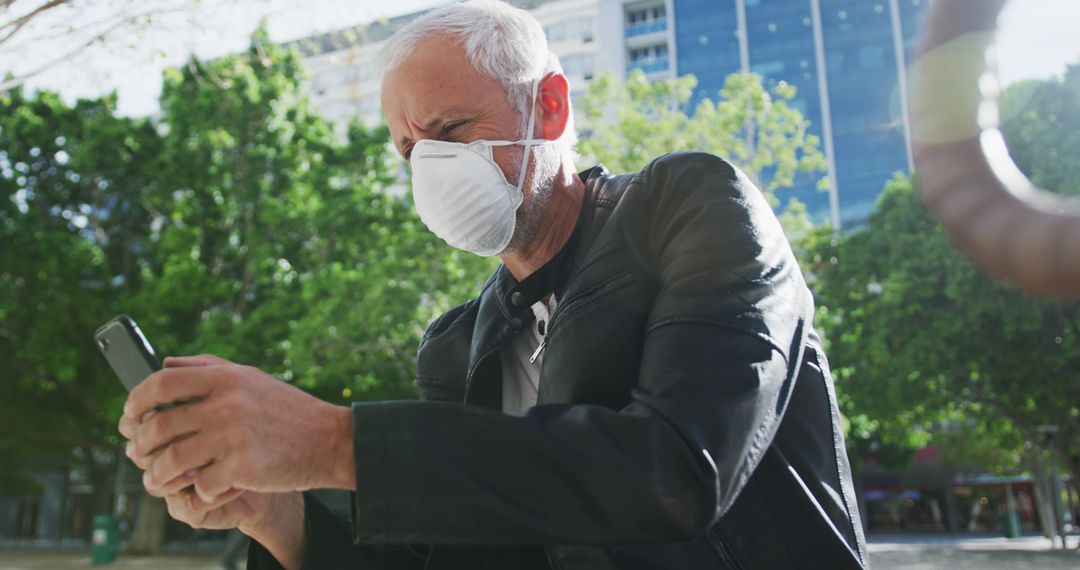 Senior Man Wearing Face Mask Using Smartphone Outdoors - Free Images, Stock Photos and Pictures on Pikwizard.com