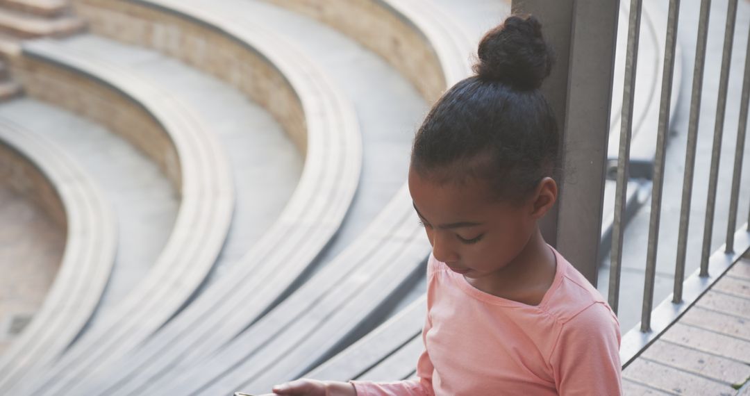 Focused Student Using Smartphone on School Steps for Learning