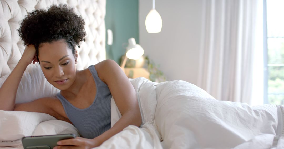 Woman Relaxing in Bed with Digital Tablet in Morning Light - Free Images, Stock Photos and Pictures on Pikwizard.com