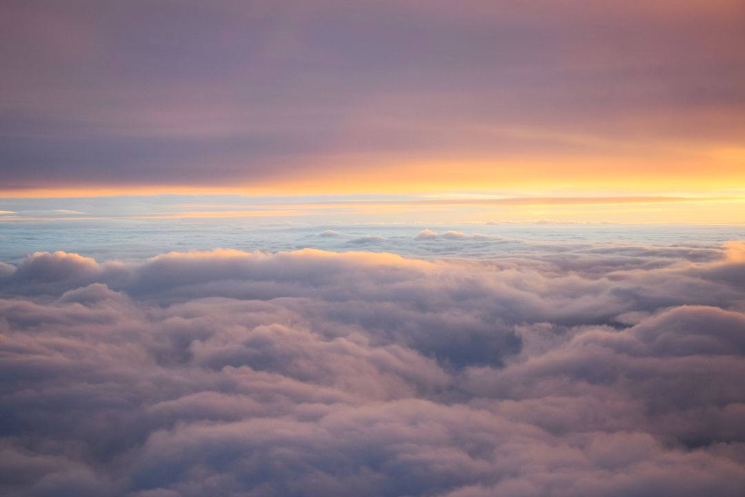 Mesmerizing Sunset Above Fluffy Clouds - Free Images, Stock Photos and Pictures on Pikwizard.com