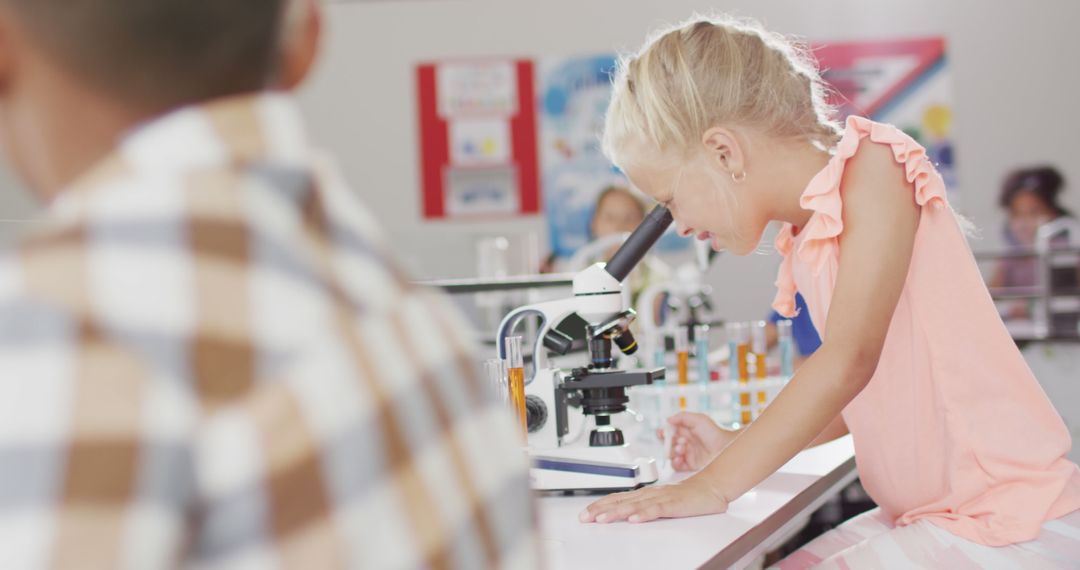 Image of happy caucasian girl with microscope during lesson - Free Images, Stock Photos and Pictures on Pikwizard.com