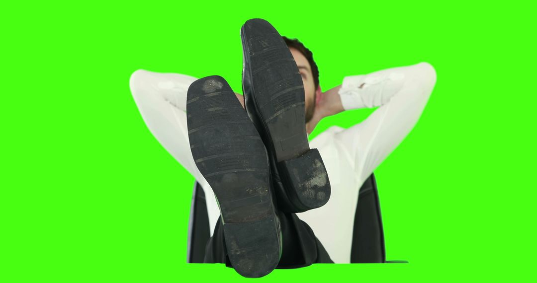 Businessman Relaxing with Feet on Desk Against Green Screen - Free Images, Stock Photos and Pictures on Pikwizard.com