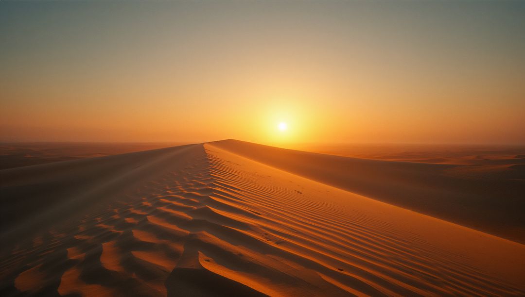 Serene Sunset Over Sand Dunes with Rippled Patterns