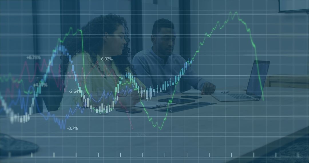 Business Professionals Analyzing Financial Data Trends and Graphs