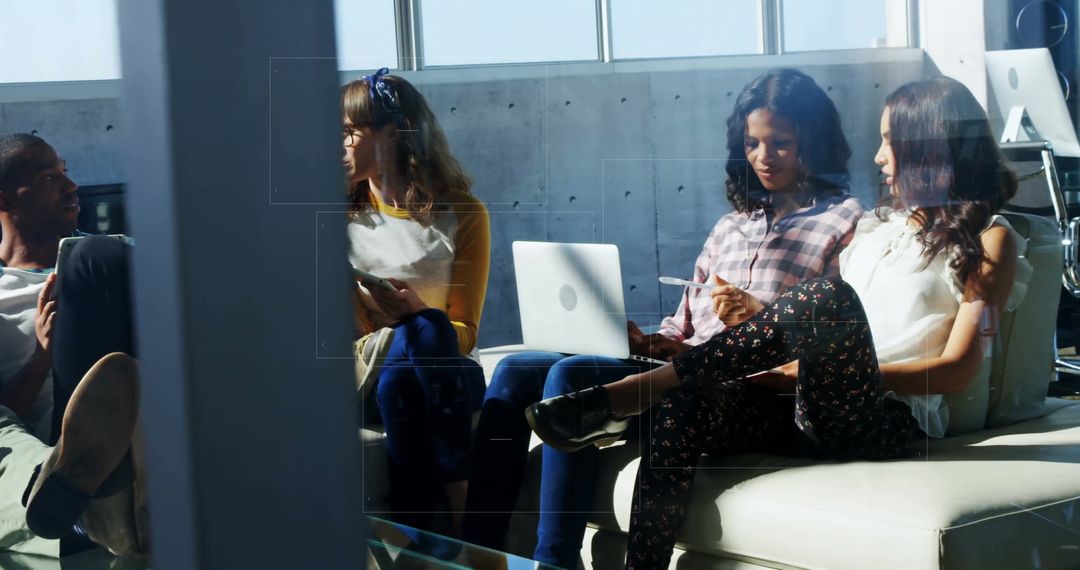 Casual Team Collaboration and Discussion in Modern Office Lounge