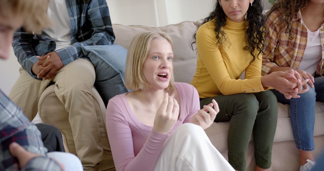 Young Woman Expressing Opinions in Group Discussion at Home - Free Images, Stock Photos and Pictures on Pikwizard.com