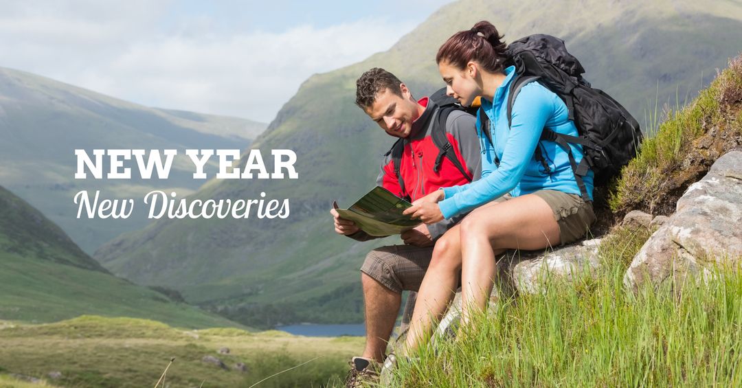 Couple Hiking in Scenic Mountain Landscape Holding Map