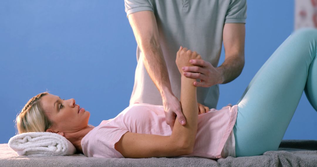 Physiotherapist Treating Female Patient's Shoulder Pain - Free Images, Stock Photos and Pictures on Pikwizard.com