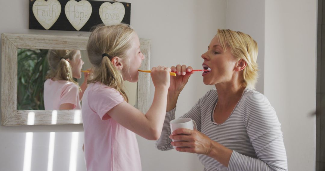 Mother and Daughter Brushing Teeth for Oral Hygiene Routine - Free Images, Stock Photos and Pictures on Pikwizard.com