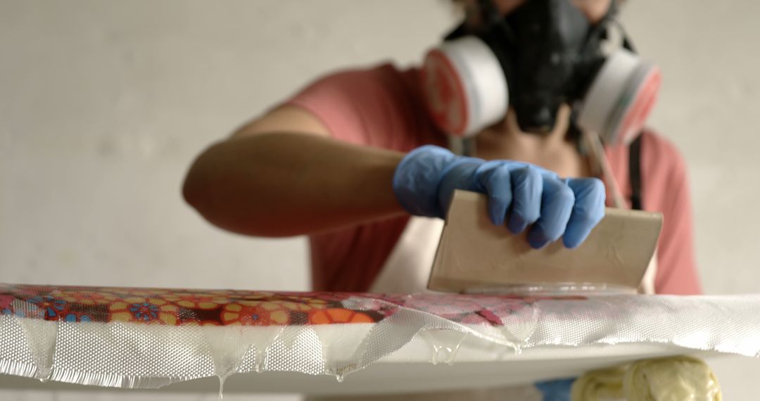 Person Using Protective Gear Working on Resin Art Craft - Free Images, Stock Photos and Pictures on Pikwizard.com