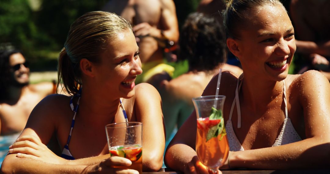 Joyful Friends Relaxing by Poolside with Refreshing Drinks - Free Images, Stock Photos and Pictures on Pikwizard.com