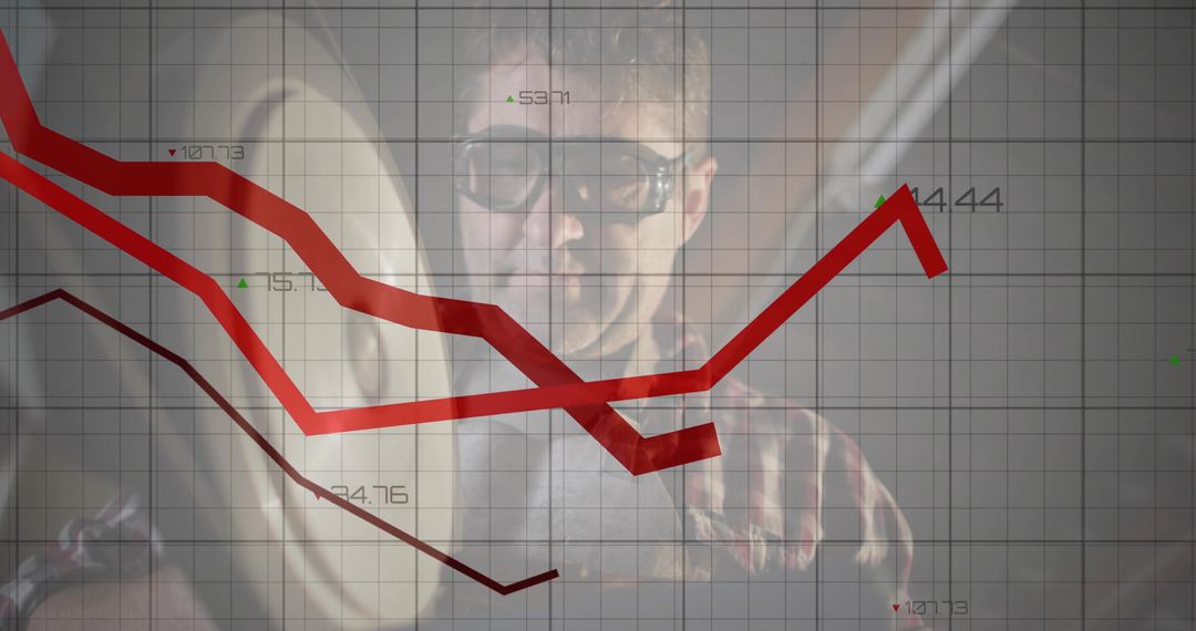 Professional Analyst Examining Red Line Graphs for Financial Insights