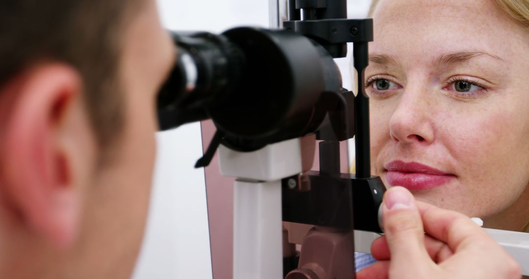 Optometrist Conducting Eye Exam for Patient in Clinic - Free Images, Stock Photos and Pictures on Pikwizard.com