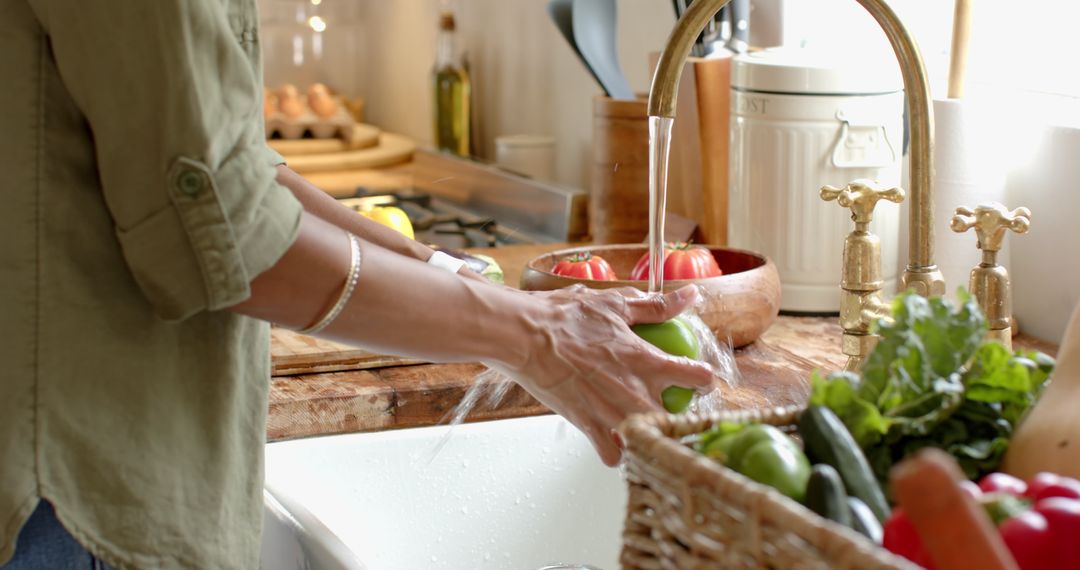 Woman Washing Apple in Rustic Kitchen with Fresh Vegetables