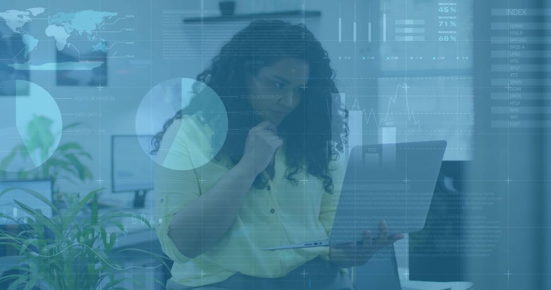 Businesswoman Analyzing Data on Laptop in Modern Office Setting