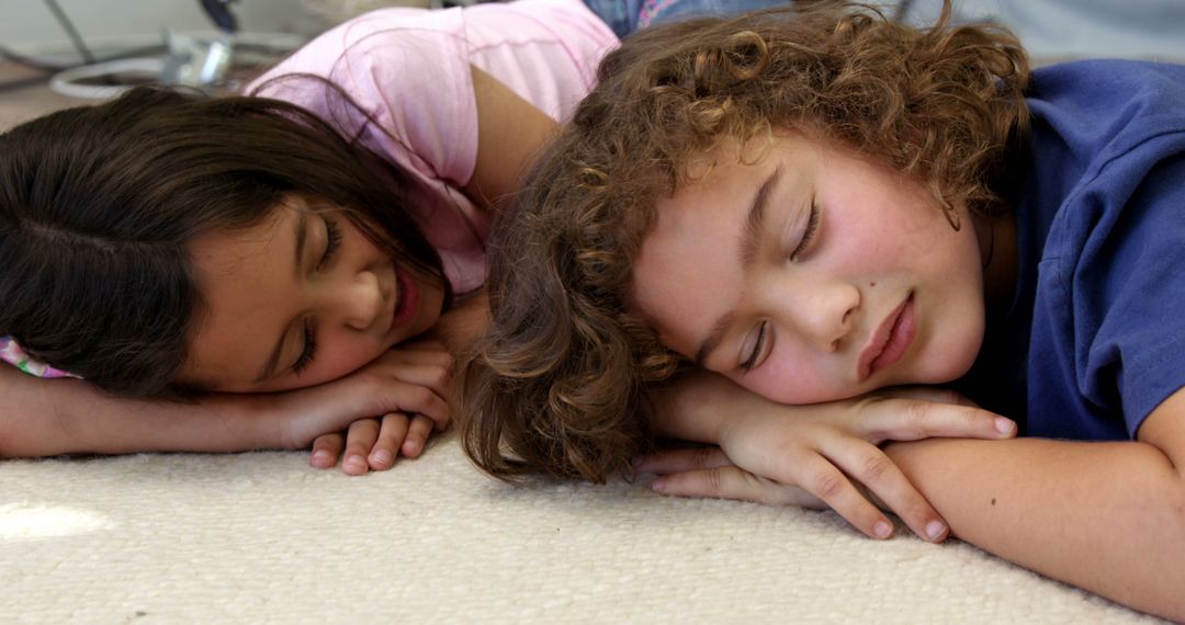 Two Children Napping on Carpet in Home Setting - Free Images, Stock Photos and Pictures on Pikwizard.com