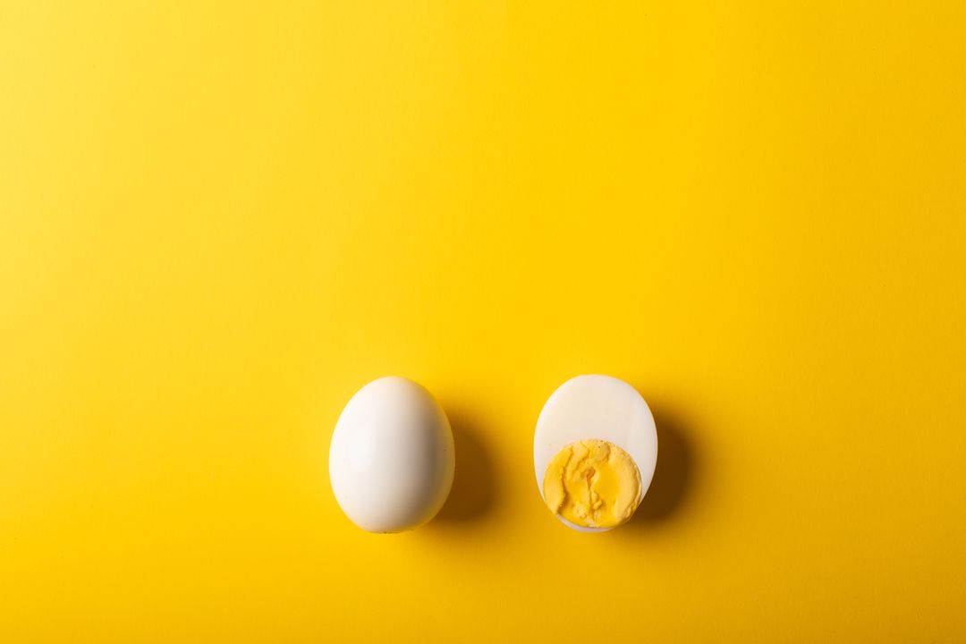 Overhead view of boiled eggs on yellow background, copy space - Free Images, Stock Photos and Pictures on Pikwizard.com