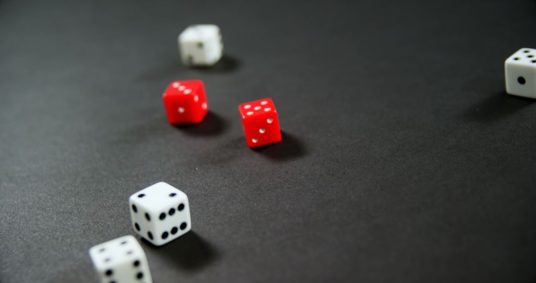 Close-Up of Dice in Motion on Dark Background - Free Images, Stock Photos and Pictures on Pikwizard.com