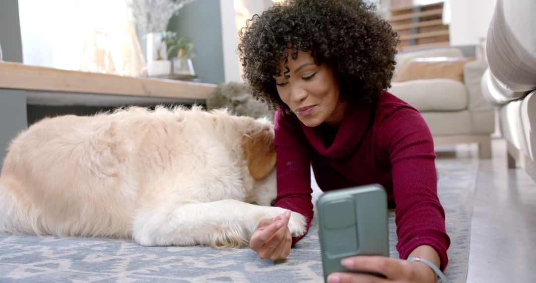 Smiling Woman with Curly Hair Video Chatting with Pet Dog at Home - Free Images, Stock Photos and Pictures on Pikwizard.com