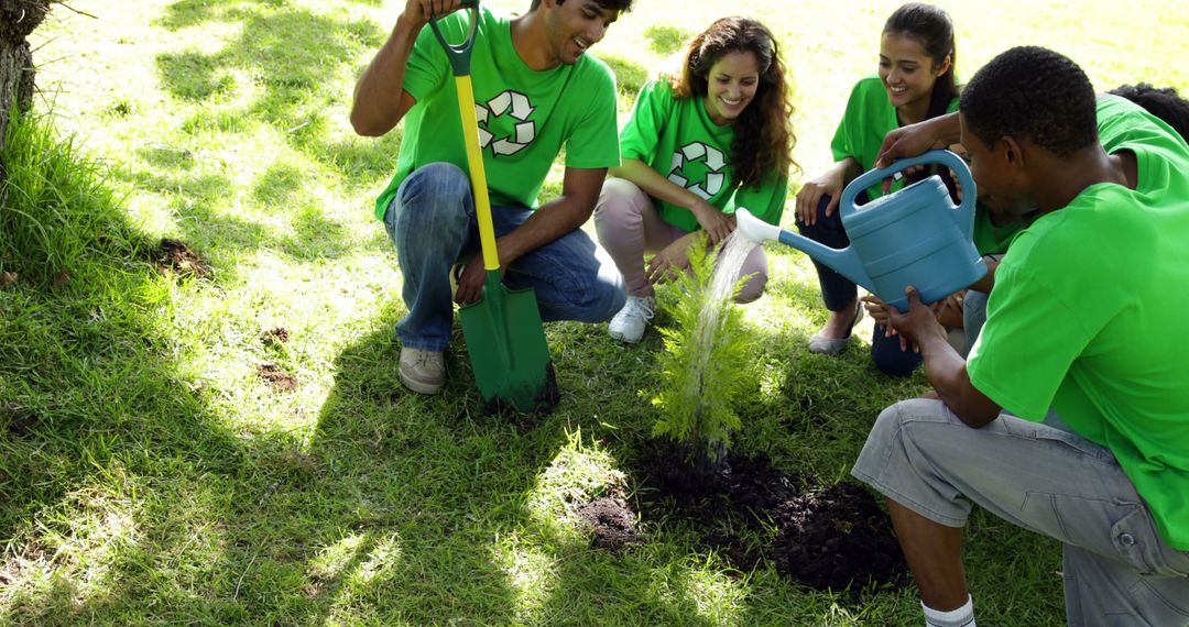 Group of Young Volunteers Planting Tree in Park - Free Images, Stock Photos and Pictures on Pikwizard.com