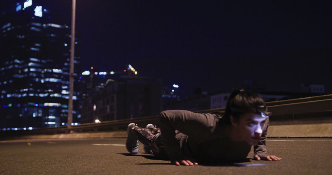 Man Exercising at Night on City Street with Headlamp - Free Images, Stock Photos and Pictures on Pikwizard.com