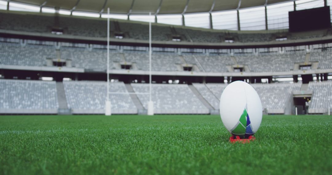 Rugby Ball on Stadium Field with Empty Stands - Free Images, Stock Photos and Pictures on Pikwizard.com