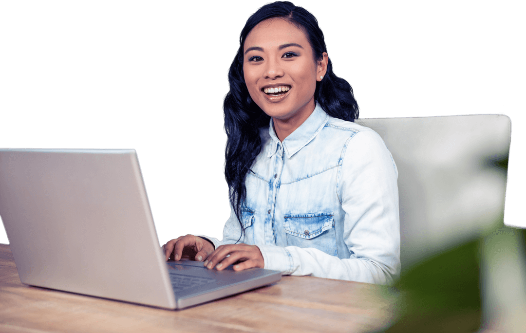Confident Asian Woman Using Laptop in Modern Workspace Cutout