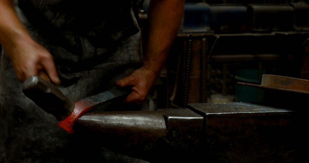 Blacksmith Hammering Red-Hot Metal with Hammer and Anvil - Free Images, Stock Photos and Pictures on Pikwizard.com